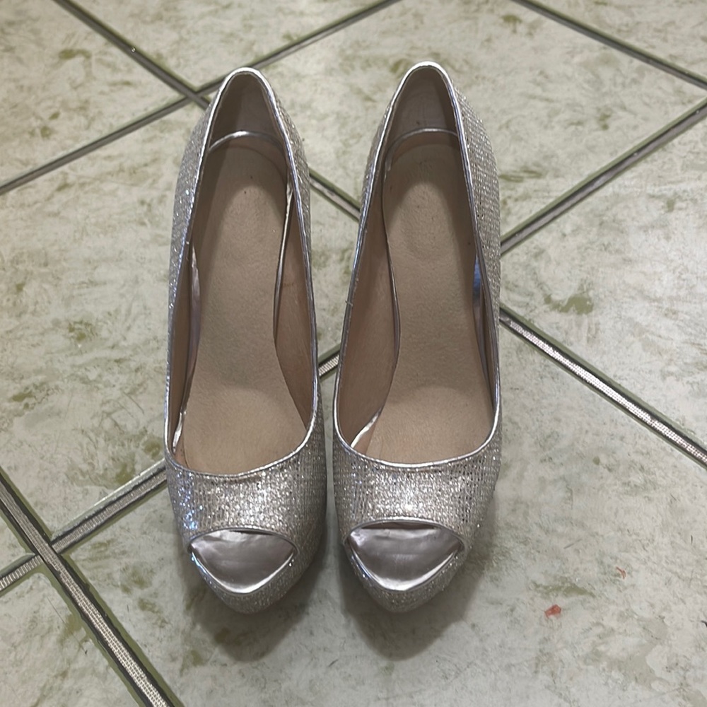 Selling silver heels size 9